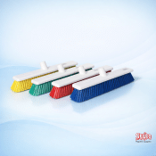 An 18 inch HACCP color-coded hygiene sweeping brush head in a professional setting