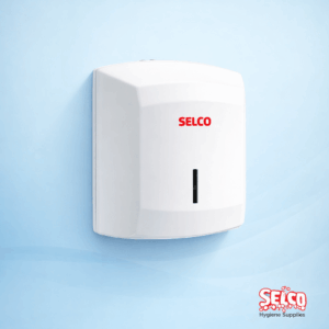 A white wall-mounted centrefeed roll dispenser for commercial kitchens and washrooms Ireland