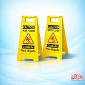 A professional high-visibility yellow folding A-frame safety sign with Caution Wet Floor text and icon