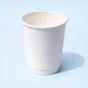 A stack of white 12oz double wall compostable coffee cups for catering in Ireland